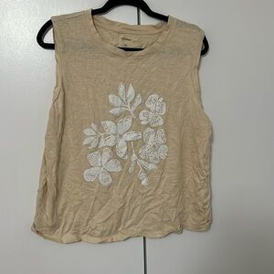 Cream colored muscle top.